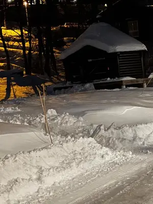a pile of snow on the side of a road at Apartment Øvre Tråstølen - Voss in Vossevangen