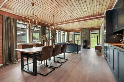 a kitchen and dining room with a table and chairs at Large nice apartment in Myrkdalen in Vossevangen