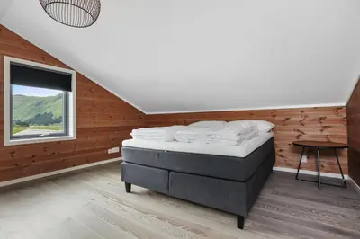 a bedroom with a bed and a window at Large nice apartment in Myrkdalen in Vossevangen