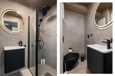 a bathroom with a shower and a toilet and a sink at King bed - Free parking - Renovated June 2025 in Bergen