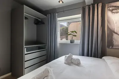 a bedroom with a bed and a window at King bed - Free parking - Renovated June 2025 in Bergen