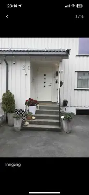 a building with stairs and potted plants in front of it at Lade - Aqua Nor 2025 - inntil 7 personer in Lii