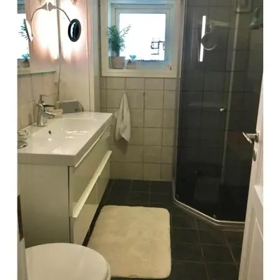 a bathroom with a sink toilet and a shower at Lade - Aqua Nor 2025 - inntil 7 personer in Lii