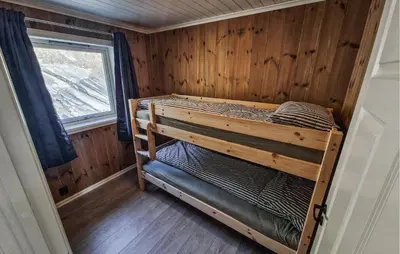 a bedroom with a bunk bed in a room with a window at Nice Home In Hafslo With Wifi in Hafslo