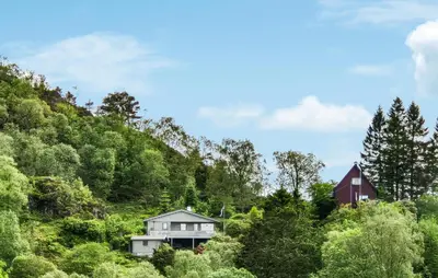 a house in the middle of a hill at Amazing Home In Frekhaug in Frekhaug