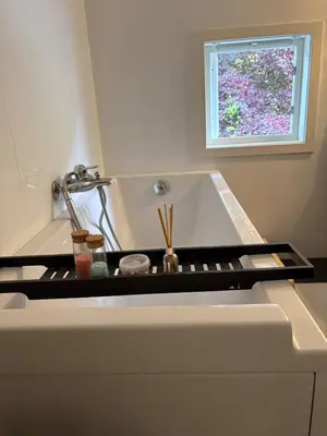 a kitchen counter with a sink and a window at Entire home with pool and garden in Ålesund