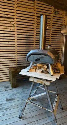 a wood stove sitting on top of a table at Entire home with pool and garden in Ålesund