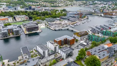 an aerial view of a city with a river and buildings at Roomsly Apartments - City flat with Private Balcony in Bergen