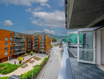 an apartment balcony with a view of a street at Roomsly Apartments - City flat with Private Balcony in Bergen