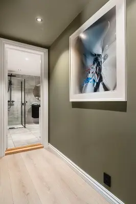 a bathroom with a picture on the wall at Trolltunga Fjord Stay in Odda
