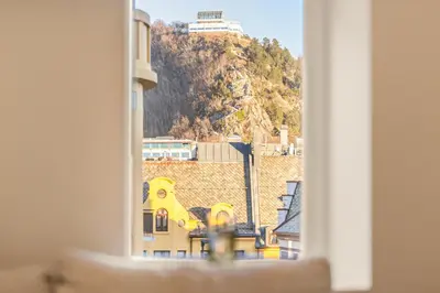 a view of a mountain from a window at Apartment in the heart of Ålesund city in Ålesund