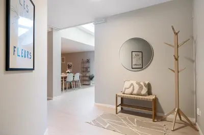 a living room with a mirror and a bench at Central stay apartment - 201 in Bergen