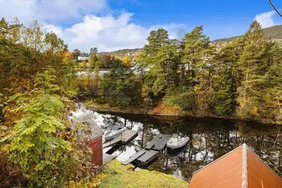 an aerial view of a dock with boats in the water at Traditional Norwegian Villa, Bay view and boat in Bergen