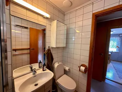 a white bathroom with a sink and a toilet at Family house near Kvitfjell & Hunderfossen in Fåvang
