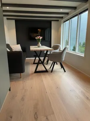 a living room with a table and chairs and a couch at Olden Tinyhouse - Modern Living in Olden