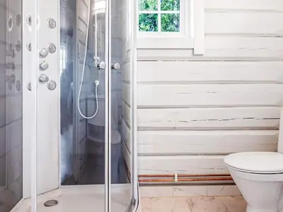 a bathroom with a shower and a toilet at 8 person holiday home in Ålen in Ålen