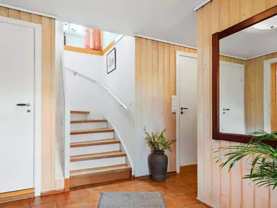a staircase in a house with a mirror at 8 person holiday home in Stavang in Stavang