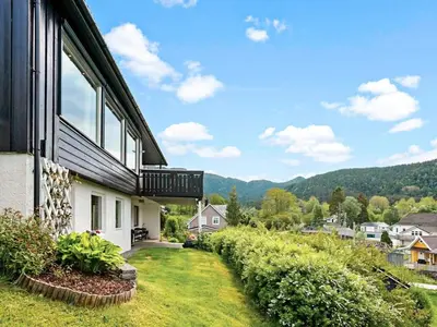 a house with a balcony on the side of it at 8 person holiday home in Stavang in Stavang