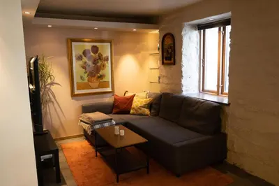a living room with a couch and a table at Private Apartment in Bergen in Bergen