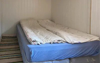 a bed with a blue mattress in a room at Stunning Home In Eidsvåg I Romsdal in Toven
