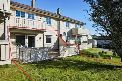 a house with a hose on the front yard at Furnished apartment near Aker Solutions in Stord