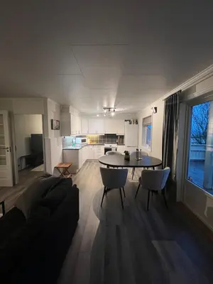 a living room with a couch and a table at Furnished apartment near Aker Solutions in Stord