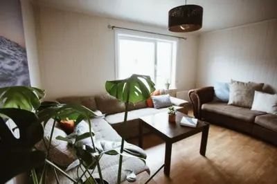 a living room with a couch and a table at Location, location, location in Ervik