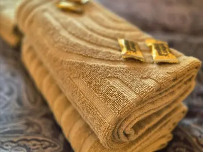 a close up of a piece of cloth with two gold clips at Trines Hjerterom in Steinkjer