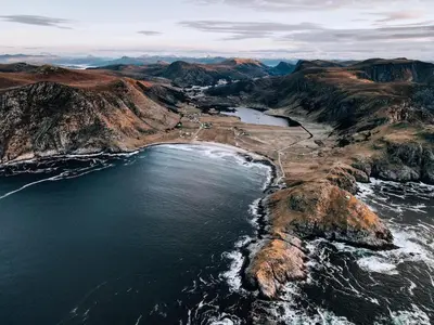 an aerial view of the ocean and mountains at Beach apartment with unique view in Ervik