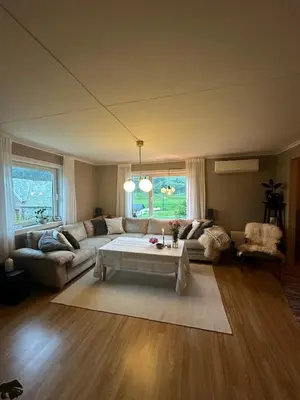 a living room with a couch and a coffee table at Location, location, location in Ervik