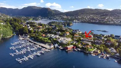 an aerial view of a harbor with boats in the water at Lille Luxury moderne feriehus med stor uteplass, utekjøkken og pergola in Bergen