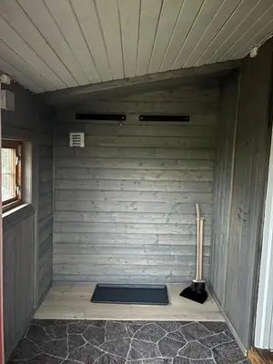 a corner of a room with a wall with a yoga mat at Koselig hytte på hugastølen in Vang I Valdres