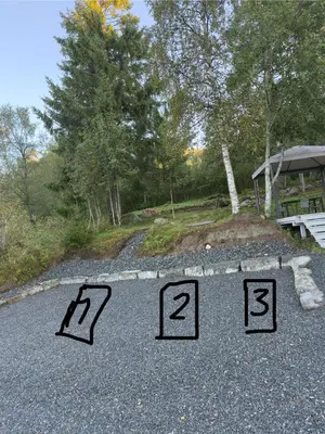 a driveway with seven numbers on the ground at Cozy apartment in Tennfjord in Tennfjord