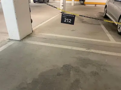 a parking lot with a sign that reads parking garage at Central, Cozy & Pet-Friendly in Beitostøl