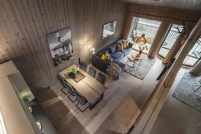 an overhead view of a living room with a couch and a table at Penthouse with large rooftop terrace, Ski In-Ski Out in Hemsedal in Hemsedal