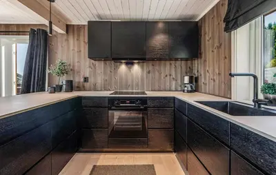 a kitchen with black cabinets and a sink at Amazing Home In Ål - With Wifi in Ål