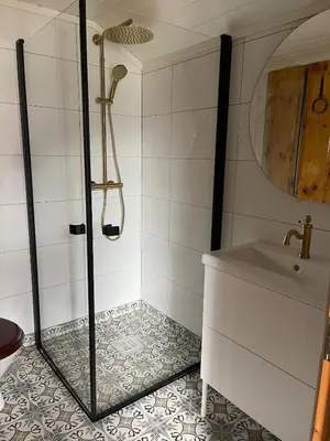 a bathroom with a shower and a sink at Cabin in Oppstryn in Stryn