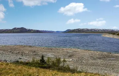 a large body of water with mountains in the background at Awesome Home In Uvdal With Sauna in Uvdal