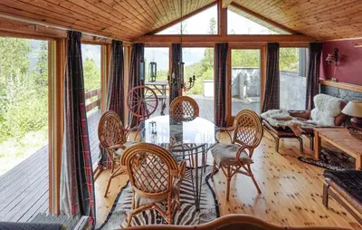 a dining room with a table and chairs at Awesome Home In Uvdal With Sauna in Uvdal