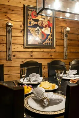 a dining room with a table with plates of food at Spacious Family Cabin At Nesfjellet With Views in Nesbyen
