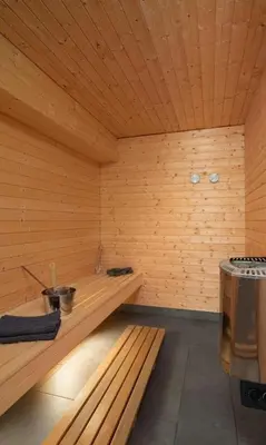 a sauna with a bench in a wooden room at Spacious Family Cabin At Nesfjellet With Views in Nesbyen
