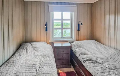two beds in a room with a window at Amazing Home In Hemsedal With Wifi in Hemsedal