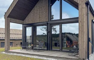 a screened in porch with chairs and a table at Stunning Home In Nesbyen With Wifi in Nesbyen
