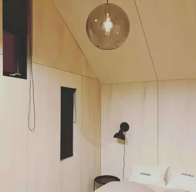 a room with a bed and a light on the ceiling at Modern Cabin Near Auersvatn And Ski Trails in Hovden