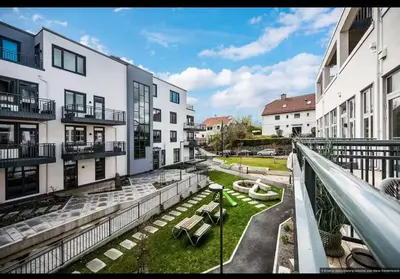 a balcony of a building with a slide at ingen in Bergen