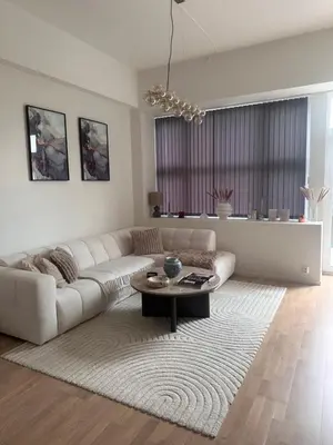 a living room with a couch and a coffee table at ingen in Bergen
