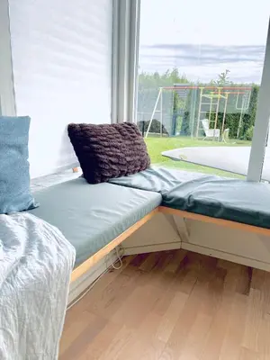 a window seat in a room with a large window at Floien City Apartment -Free parking in Bergen