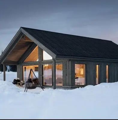 a cabin in the snow in the snow at Luxury Mountain Cabin Modern and Stylish in Uppheim