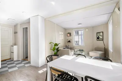 a kitchen and living room with a table and chairs at Charming Townhouse - Walk Everywhere! in Bergen