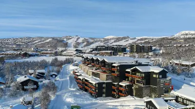 an aerial view of a resort in the snow at Sentral, Hc-Friendly Apartment in Beitostøl
